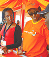 Cleophas Kabasiita (left), Rwandatel Public Relations Manager with her colleague Nelly Mugiraneza, from the sales department at Gikondo Expo grounds. (Photo / G. Barya).
