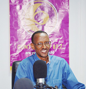 President Paul Kagame responding to callers' questions during Radio Contact FM's Crossfire session. (PPU Photo)