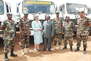 US Embassy Deputy Head of Mission, Cheryl Jane Sim hands over the equipment to Defence Minister Marcel Gatsinzi. They are flanked by top military commanders. (Photo / J. Mbanda).