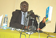 Tharcise Karugarama shows the Mucyo Commission Report implicating France in the 1994 Rwanda Genocide to the media and public. (File Photo).