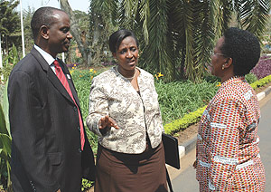 Foreign Affairs Minister, Rosemary Museminari (C) talks to Amb. Liberata Mulamula (R) and Richard Sezibera at Hotel Novotel yesterday. (Photo/ J. Mbanda)