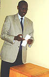 Amb. Ignatius Kamali Karegyesa before casting his vote on Monday.