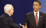 Barack Obama and John McCain shake hands at the start of their first televised debate, a crucial step in the election process.
