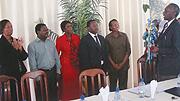 THANK YOU: NEC Chairman Chrysologue Karangwa (R) talks to Kigali City officials while presenting them an award.