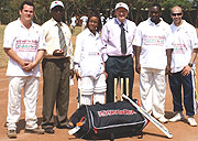 GONE WITH THE WIND:  Haba (2nd left) poses for a shot with Fina Banku2019s managing director Steve Caley (3rd from right) and crickAid officials. (File photo).