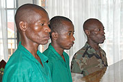 Pte. Jean Bosco Bizimana Misoro (in army fatigues, extreme right) with two others accused of hiding him after he had killed six people, at a Military Tribunal yesterday. (Photo/ J.Mbanda)