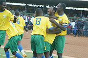 SWEET VICTORY:  Amavubi Stars captain Olivier Karekezi (right) and defender Elias Ntwaganda (shirt 13) celebrate  Saidi Abediu2019s (middle) opening goal against Morocco in Kigali. Rwanda won 3-1.