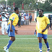 Bokota Kamana(L) and Said Abedi celebrate Rwandau2019s goal against Mauritania.The pair will be up against a much tougher opposition in the next round    (File photo)