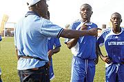 PLEASE HELP ME:  Rayon coach Raoul Shungu passing on new tactics to his players during a league match. The Congolese tactician badly needs a win under his belt to save his job.