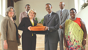 US Secretary of Education Margaret Spellings receives a gift from President Paul Kagame yesterday at Village Urugwiro.(Photo /J. Mbanda)