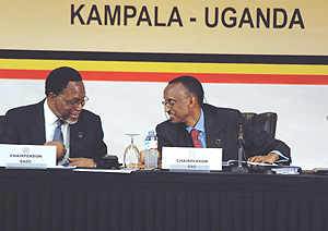 CAN WE TRADE? President Kagame sharing a light moment with South Africau2019s new President, Kgalema Motlanthe, during the Tripartite Summit in Kampala. (PPU photo).