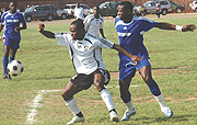 DEBUT:  Bokungu battles with Rayon defender Rucogoza yesterday in Muhanga. The Congolese striker scored on his debut for the nine-time league champions. (Photo/ D. Kasule)