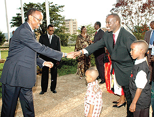 President Kagame congratulates Dr. Richard Sezibera outside Parliament after the latter had sworn in as Health Minister. (PPU photo).