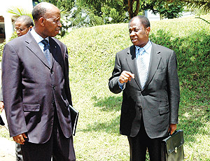 Amb. Joseph Mutaboba (L) chats with DRC Foreign Affairs Minister, Thambwe Mwamba.(PPU photo)