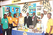 Rwanda Embassy staff pose with the exhibitors at the Rwandan stall.
