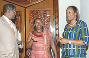 The Minister of Commerce, Monique Nsazabaganwa (C) chatting   with Speaker of Parliament, Rose Mukantabana ( R) and Vice Speaker, Denis Police at Parliament yesterday.( Photo/G.Barya)