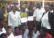 Minister Jeanne du2019Arc Mujawamariya (Row 2, third L) poses with some of the Women Empowerment Project members after the launch. (Photo/ R.Mugabe).