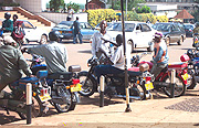 Motorcyclists waiting for clients.
