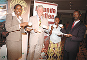 Former President Clinton with the State Minister of Agriculture during the launch of Rwanda Coffee recently.