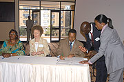 Minister of State in charge of HIV/AIDS, Dr. Innocent Nyaruhirira signs the Healthy system strengthening grant worth 33 US Million dollars given by the Global fund for fight HIV/AIDS in Rwanda for the Period of 5 years (2005)