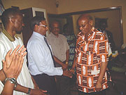Former Kigali-Virunga Rotary president, James Vuningoma (R) welcoming a new member.(File photo)