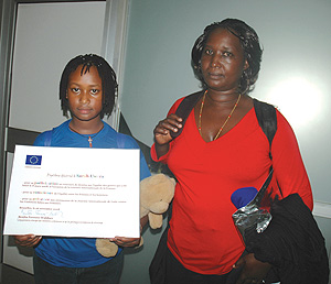 Sarah Uwera with her mother Devota Kayitesi  on arrival at Kigali International Airport from Brussels on Saturday. (Photo/ J Mbanda)