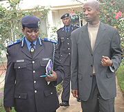 The acting Commissioner General of the Police Mary Gahonzire and Internal Security Minister Musa Fazil Harerimana .