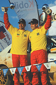 ONE HAPPY FAMILY:  Rudy Cantanhede (L) and his brother Bruno Cantanhede celebrate after winning Rallye des 1000 collines yesterday. (Photo/ G. Barya)