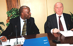 Amb. Joseph Mutaboba (L) and Roland Van de Geer at the meeting yesterday. (Photo J Mbanda).