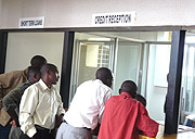 Clients at Zigama Credit Saving Society headquarter branch in Kimihura. 