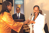 Better to invest in Rwanda: Dr Aisa Kacyira Kirabo (L), Mayor  Kigali City Council giving atrophy to one of the best investors the country at Kigali Serena  as Francis Gatare, the Rwanda Investment and Export Promotion boss looks on. (Photo / G. Barya).