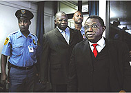 Bagosora and Nsengiyumva entering the courtroom.