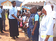 First Lady Jeanette Kagame greeting orphans at St.Elizabeth of Hungary orphanage in Rulindo Catholic Parish. ( Photo/A.Gahene).