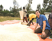 Bumper Harvest;Josh at a weighing station for the maize crop produced at the Mayange Millenium Village.