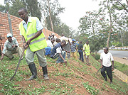 KEEP THE CITY CLEAN: Members of various cooperatives in Kigali City got together to clean the city. (Photo/ R.Mugabe)