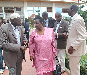 Foreign Affairs Minister Rosemary Museminari (C) listens to Hassan Hategekimana from Botswana during a meeting with members of the Rwandan Diaspora. (Photo/ J Mbanda)