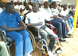 The disabled demobilised soldiers who were given houses built by the Demobilisation Commission yesterday. (Photo/G.Barya).