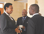 Hon. Patricia Hajabakiga (L), Hon.Mike Sebalu both from EALA and  Prudence Sebahizi chat during the meeting at Prime Holdings. (Photo/ J. Mbanda)