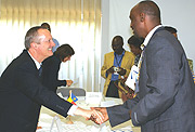 Belgian Ambassador Ivo Goemans shaking hands with a representative of one of the NGOs that signed the agreement. (Courtsey Photo)