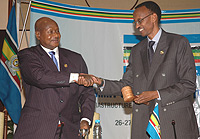 President Yoweri Museveni Handing over the  EAC Chairmanship to President Paul Kagame. (File photo)