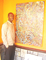 Karekezi stands besides one of his abstract creations.