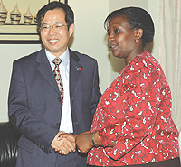 The Minister of Foreign Affairs Rosemary Museminali shakes Hands with Chinese Ambassador Sun Shuzhong Yesterday. (Photo/ G.Barya).