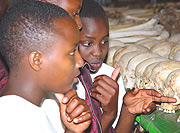 Genocide survivors at one of the memorial sites.