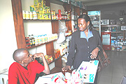 Commerce Minister Monique Nsanzabaganwa talks to a shop attendant during the recent inspection. (Photo J Mbanda).