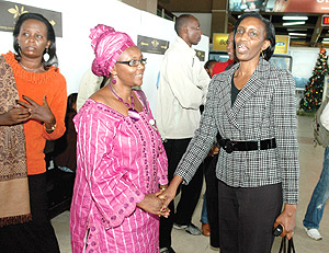 Member of Parliament Henriette Sebera, (left) bids farewell to Rose Kabuye  at  Kigali International Airport shortly before her return to France. (Photo PPU).
