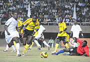 Rwanda goalkeeper Ndoli (Down) after blocking a shot from Uganda u2019s Ceaser Okuti. (Photo/A.E.ORYADA)