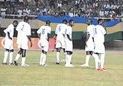 Dejected Rwanda players after conceding the third goal against Uganda.