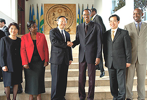 Chinese Foreign Minister Yang Jiechi shakes hands with President Paul Kagame after the formeru2019s courtesy call on the President at Urugwiro Village yesterday. (PPU Photo).