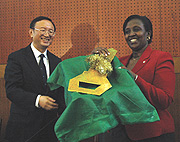  Jiechi Handing over a ceremonial key to Museminali at the unveiling of the new MINAFFET headquarters in Kimihurura. (Photo/ G. Barya).