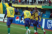 HOME COMFORT: Junior Wasps Ernest Kwizera and Aimable Rucogoza congratulate teammate Jean Baptist Mugiraneza (7) after he scored Rwandau2019s first goal .( Photo / G. Barya) 